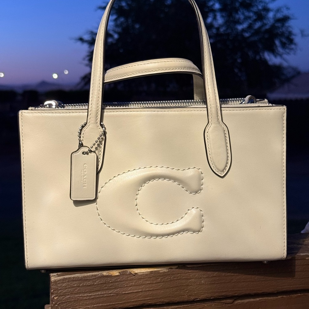 Coach Cream Satchel with Embossed Logo and Structured Design
